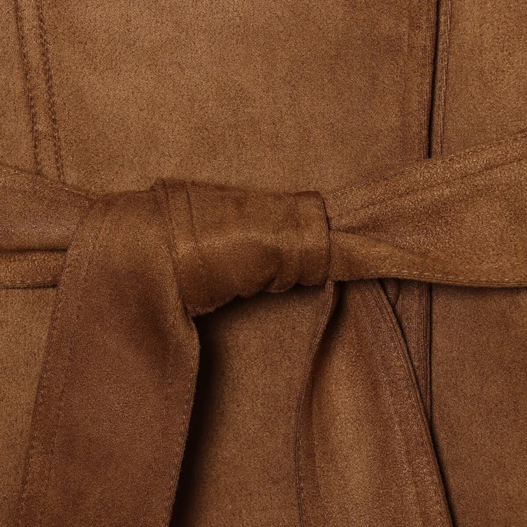 Women's tailored short jacket made of soft suede imitation with asymmetrical button placket and tie belt Mune Fashion