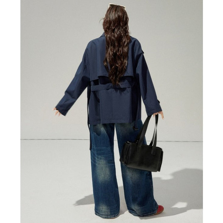 Ladies short trench coat with a flattering belt and double-breasted button placket Mune Fashion