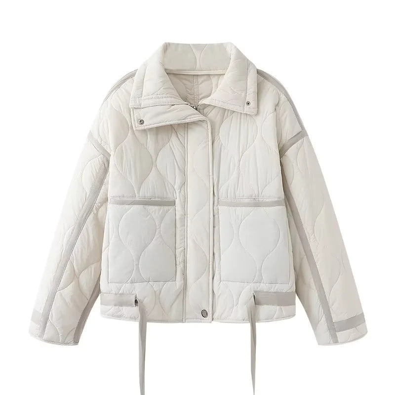 Women's quilted boxy transitional jacket with drawstring hem, stand-up collar, and patch pockets Mune Fashion