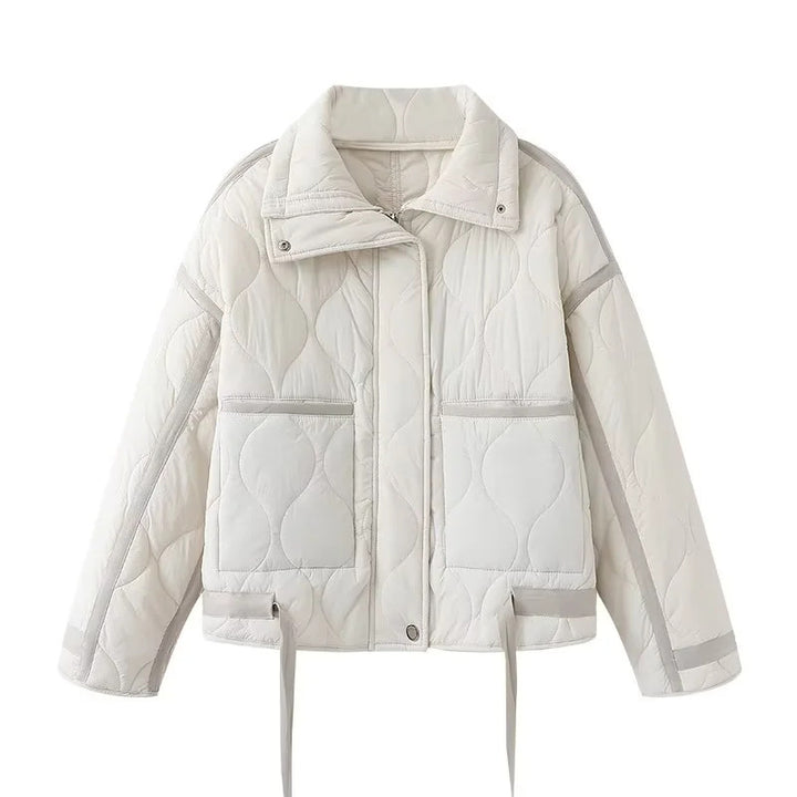 Women's quilted boxy transitional jacket with drawstring hem, stand-up collar, and patch pockets Mune Fashion