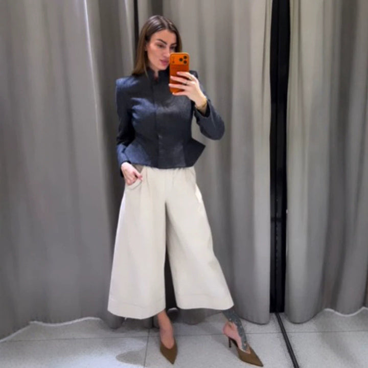 Women's short blazer with stand-up collar, fitted peplum, and concealed button placket Mune Fashion
