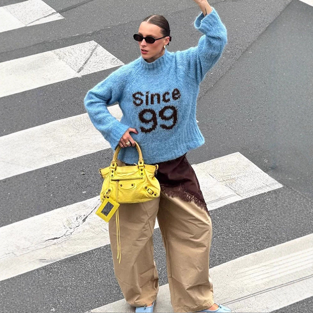 Women's cozy oversized mohair sweater with high roll neck and statement logo Mune Fashion