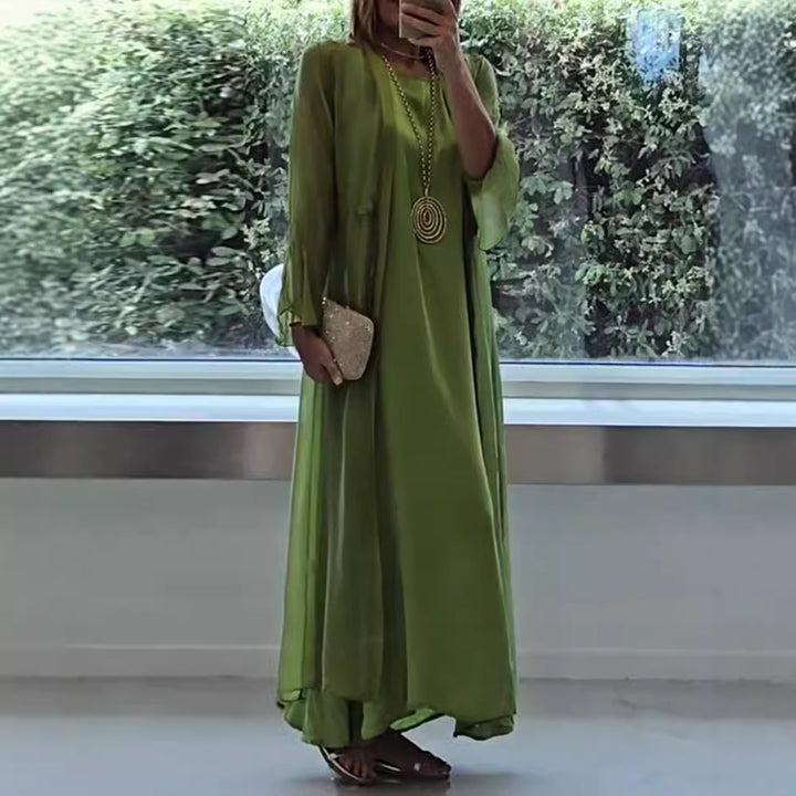 Women's double-layer evening maxi dress with transparent overlay, sleek inner dress, waist ties, and trumpet sleeves Mune Fashion