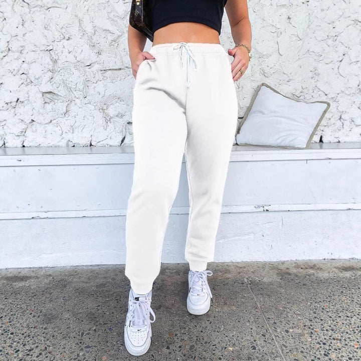 Women's tapered jogging pants at ankle height with elastic comfort waistband, adjustable drawstring, and deep side pockets Mune Fashion