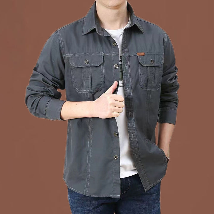 Men's robust cotton twill field shirt with patch flap chest pockets and distinctive seam details.