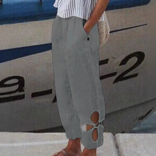 Women's ankle-length culotte pants with elastic waistband, side pockets, and floral hem cutout Mune Fashion