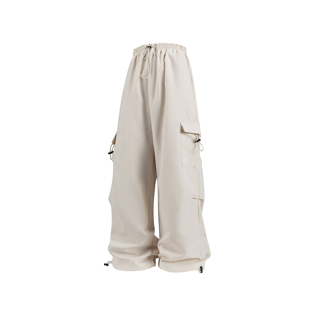 Men's wide technical cargo pants with drawstring waistband, multiple pockets and corded closure Drune