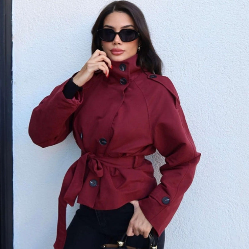 Women's short tailored trench coat with high standing collar, double-breasted button placket, and adjustable tie belt Mune Fashion