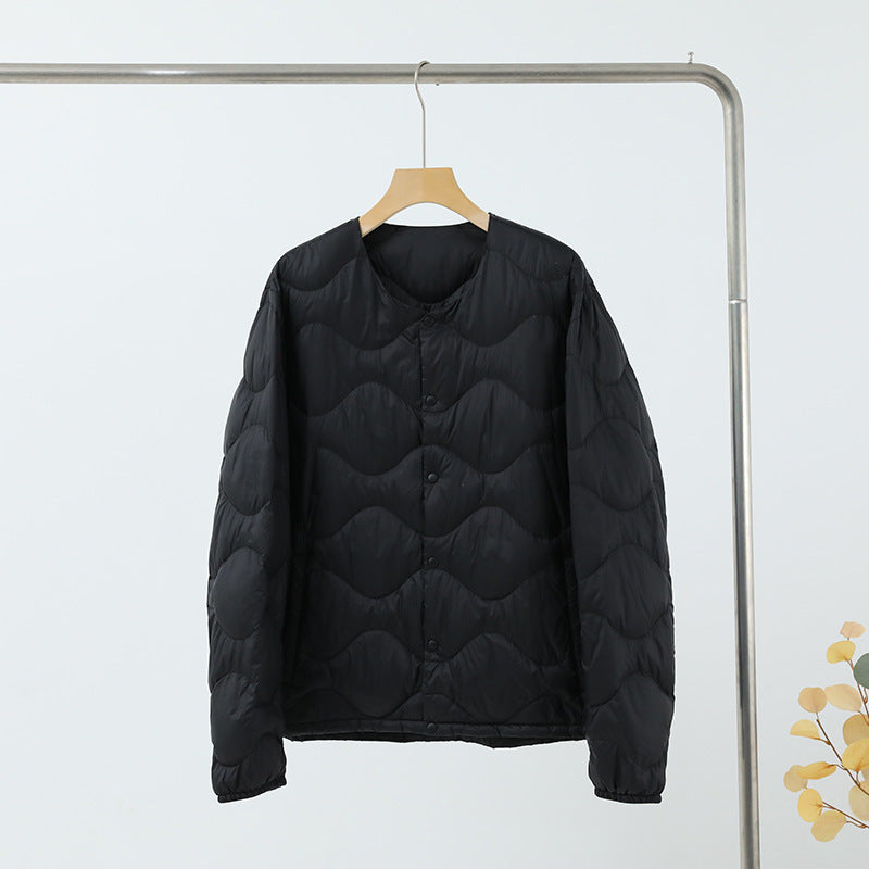 Women’s sleeveless thermal quilted vest with wave-shaped quilting and snap button closure Mune Fashion