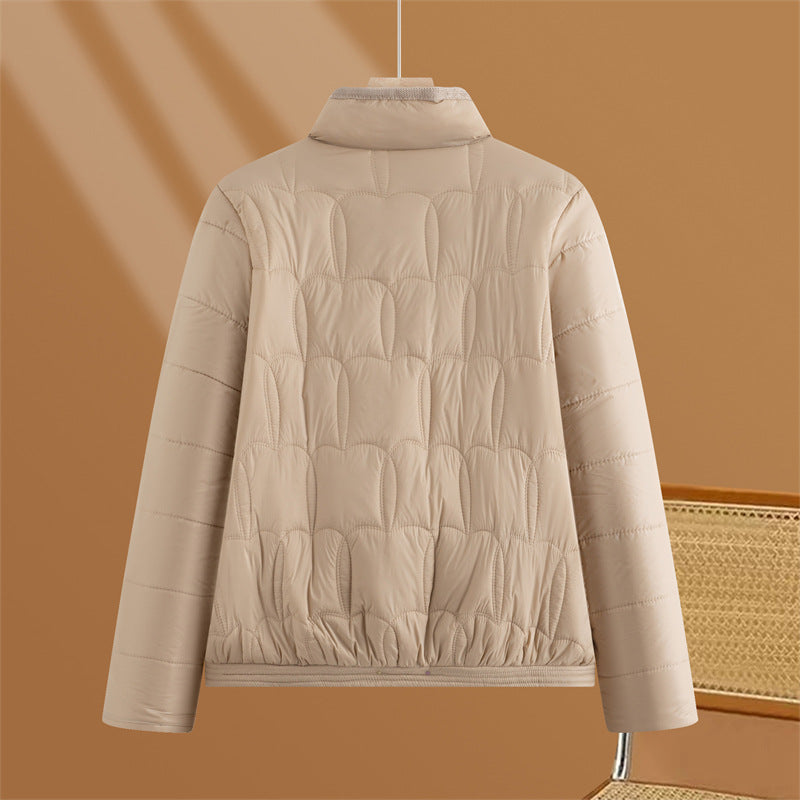 Women's short quilted transitional jacket with stand-up collar and flap pockets Mune Fashion