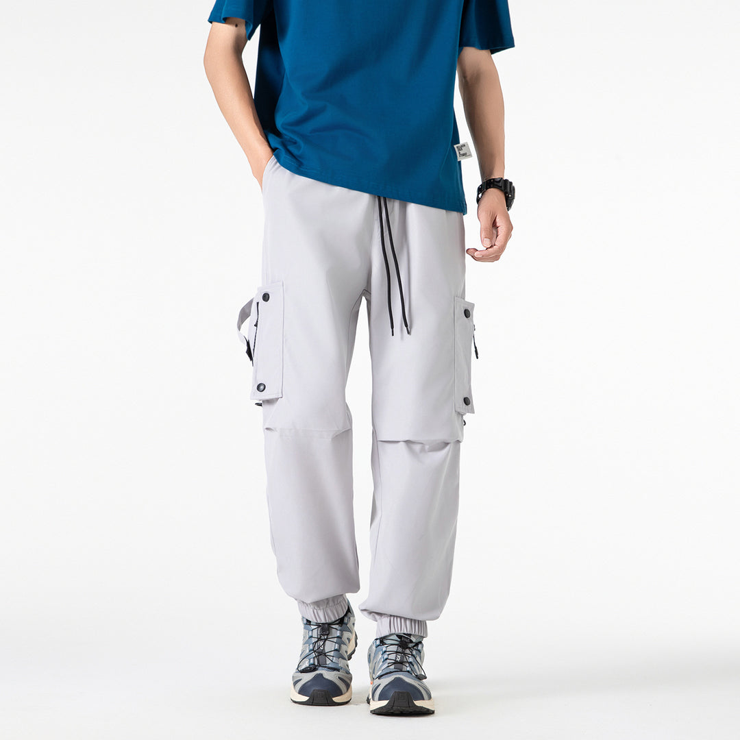 Men's Wide Technical Cargo Jogger with elastic drawstring waistband, multifunctional cargo pockets and adjustable leg openings Drune