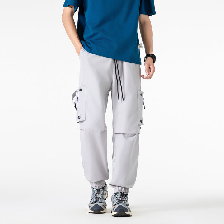 Men's Wide Technical Cargo Jogger with elastic drawstring waistband, multifunctional cargo pockets and adjustable leg openings Drune