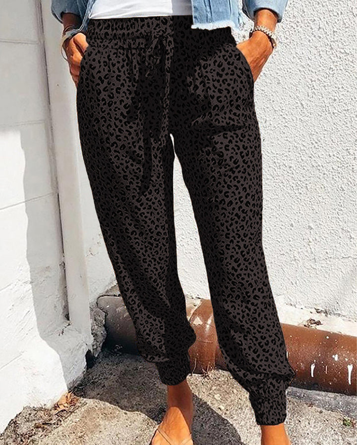 Ladies casual leopard print jogging pants with drawstring, side pockets, and elastic cuffs Mune Fashion