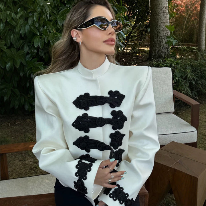 Women’s short blazer in military style with stand-up collar, decorative cord closures and contrasting application Mune Fashion