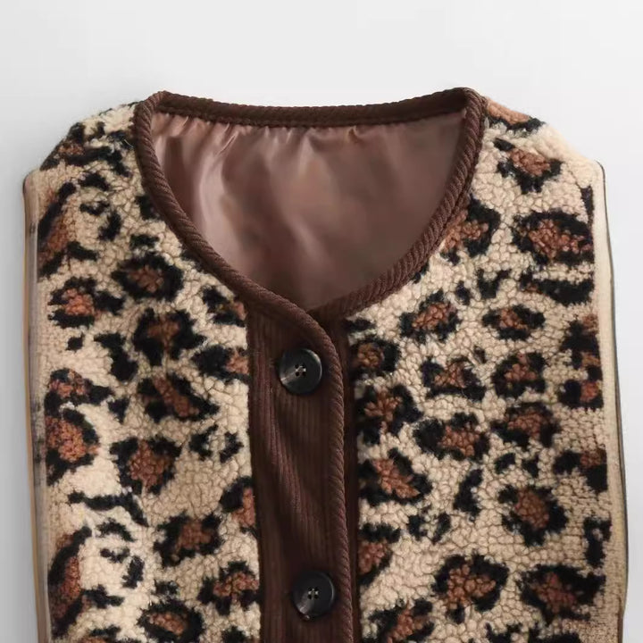 Women’s faux sheepskin jacket with leopard pattern, cord trim, full button placket, and patch pockets Mune Fashion