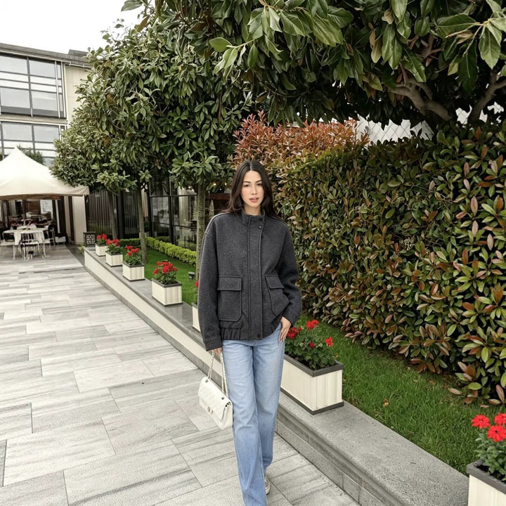 Women's wool blend blouson jacket with stand-up collar, large flap pockets, and elastic hem Mune Fashion