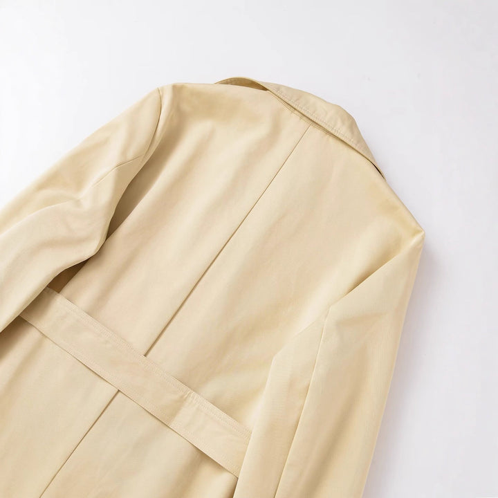 Women's midi trench coat made of lightweight functional fabric with tied belt and storm flap Mune Fashion