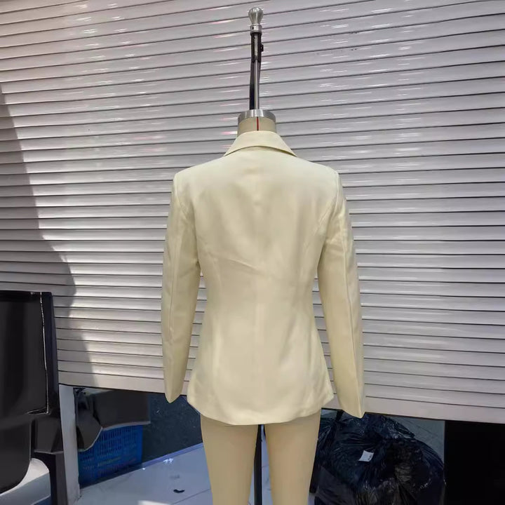 Women's tailored two-button blazer with decorative roses at the lapel and patch pockets Mune Fashion