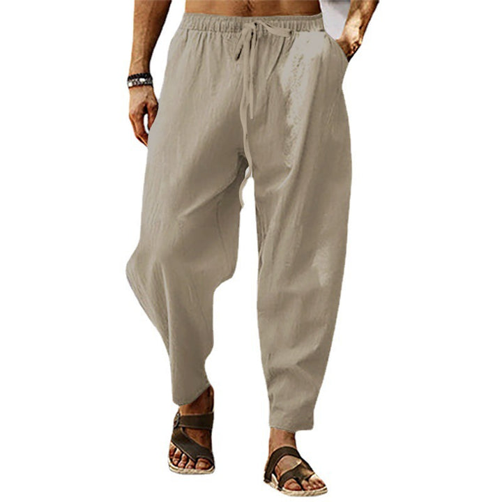 Men's lightweight harem pants in linen look with elastic drawstring waistband, side pockets, and tapered ankle cuffs Mune Fashion