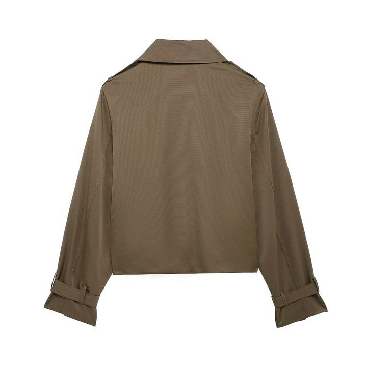 Women's short cropped trench coat in boxy cut with double-breasted button placket, shoulder epaulets and adjustable sleeve straps Mune Fashion
