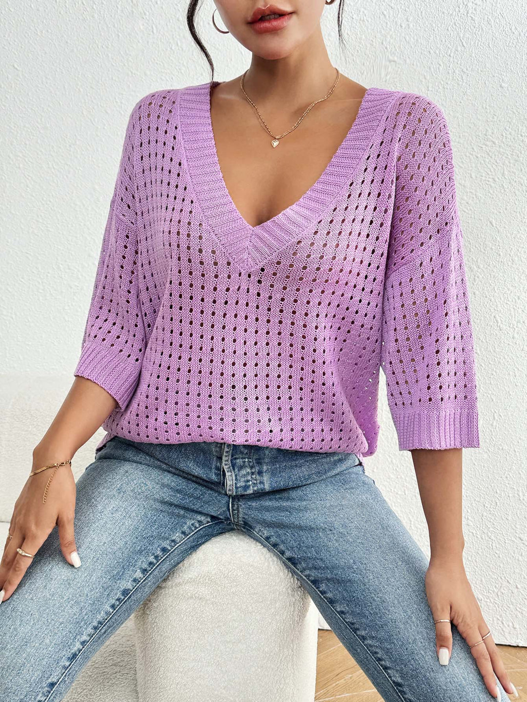 Ladies lightweight knit sweater with V-neck and decorative hole pattern Mune Fashion