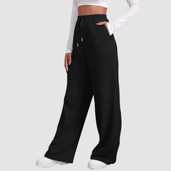 Women's flowing high-waist palazzo lounge pants made of lightweight jersey with elastic waistband and practical side pockets Mune Fashion