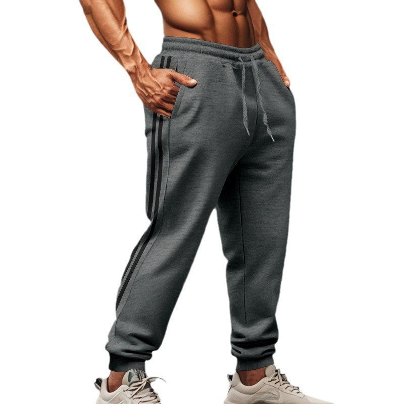 Men's sporty jogging pants with side contrast stripes, elastic drawstring waistband, and ribbed leg endings Mune Fashion