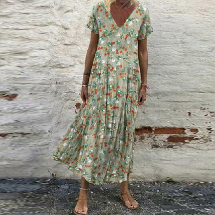 Women’s V-neck maxi dress with fine pleated skirt, empire bodice and short sleeves Mune Fashion