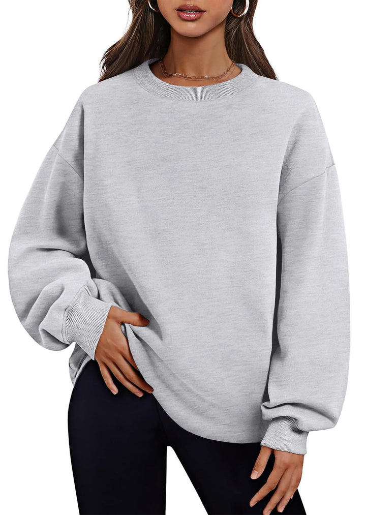 Women's extended oversized round neck sweater with side pockets, ribbed cuffs, and dropped shoulder Mune Fashion