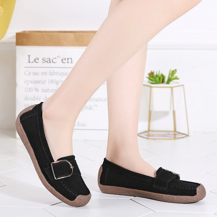 Women's moccasin slippers made of suede leather with decorative metal buckle, padded footbed, and non-slip rubber outsole Mune Fashion