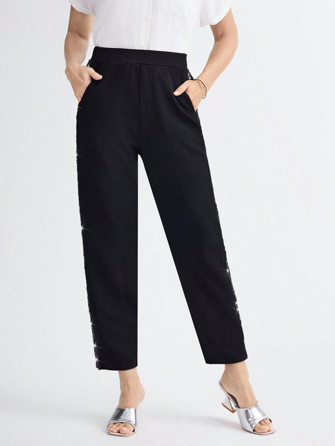 Women Elegant straight-cut fabric pants with elastic waistband and side glitter trim Mune Fashion