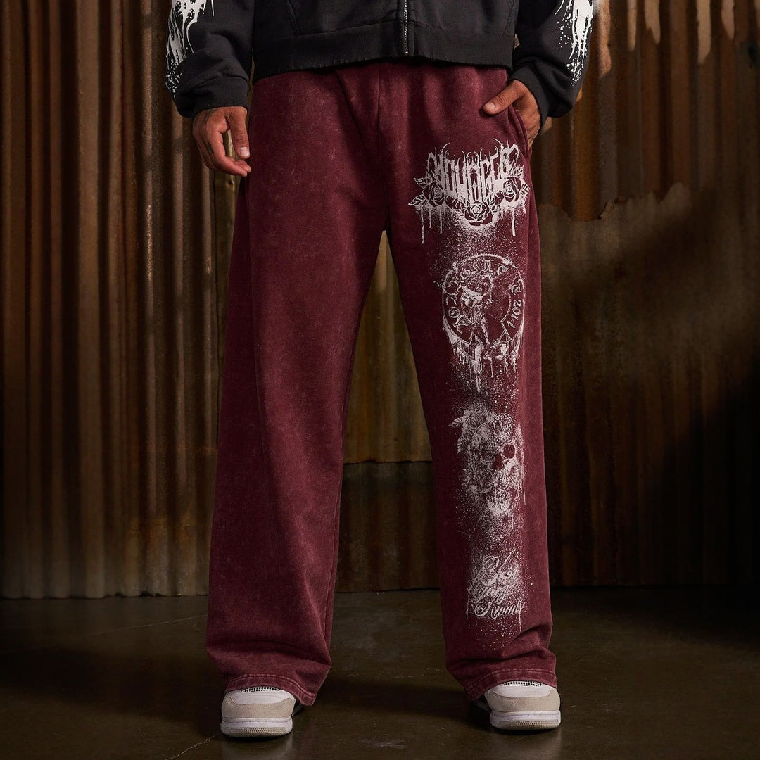 Men's baggy joggers with elastic waistband, side pockets and detailed skull and rose motif Mune Fashion