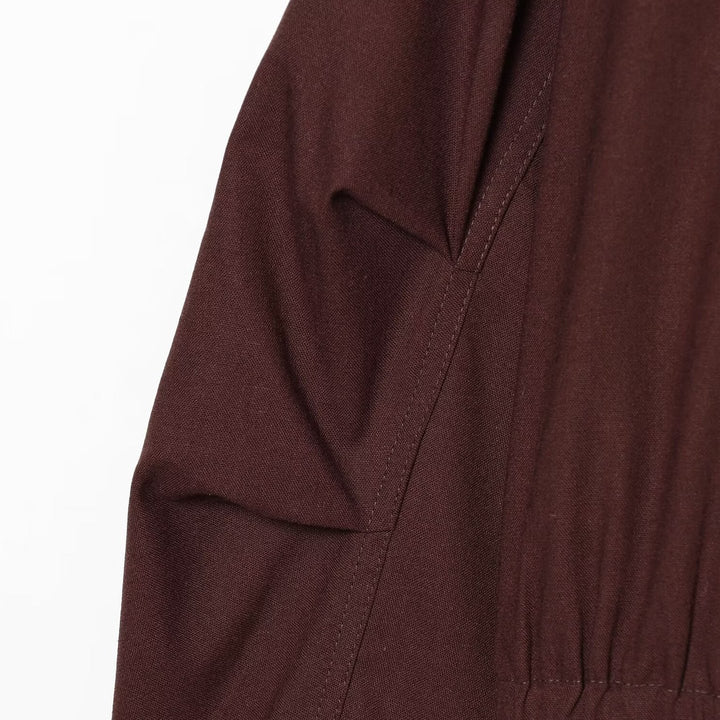 Women's short bomber-style jacket with high funnel collar, concealed zipper, and flap pockets Mune Fashion