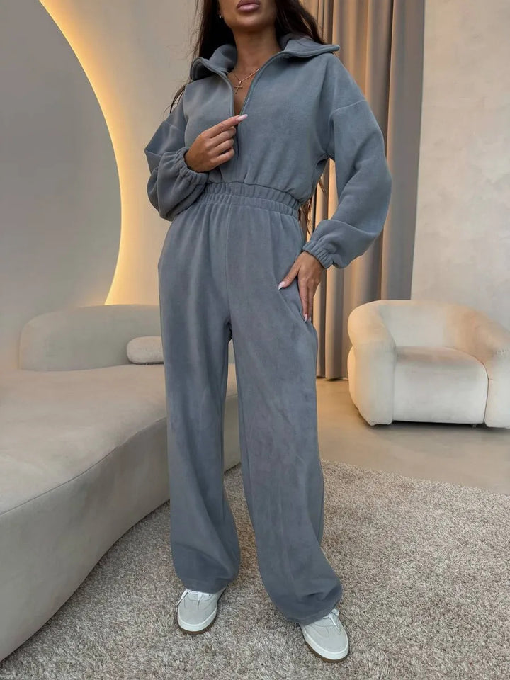Women's elegant lounge overall with elastic waistband, stand collar, zipper and wide leg.