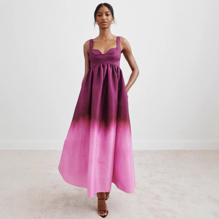 Women's floor-length bustier maxi dress with heart-shaped neckline, wide straps, and gathered empire waist Mune Fashion