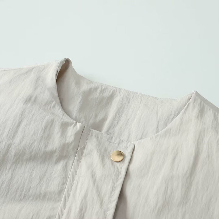 Women's lightweight utility blouson jacket with round neckline, snap button placket and large patch pockets Mune Fashion