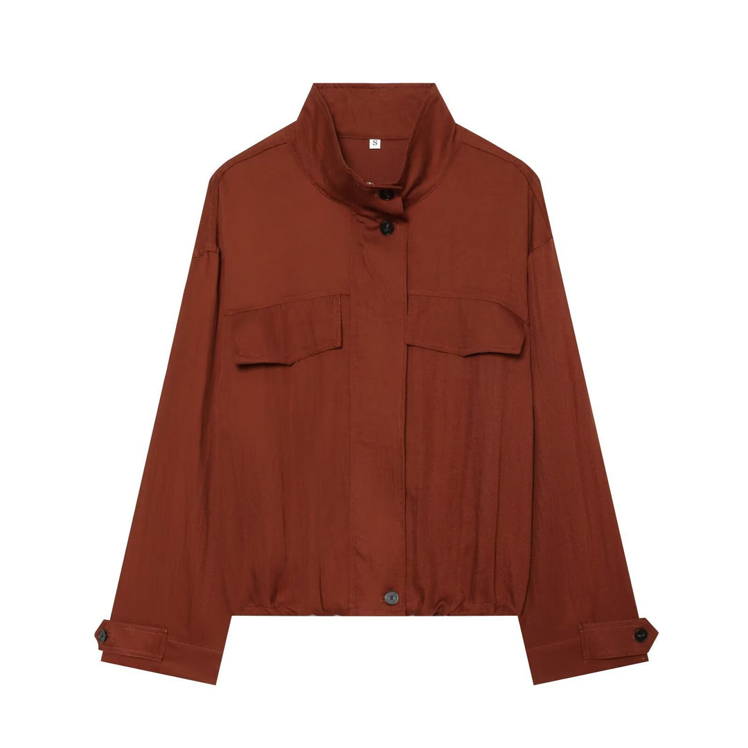 Women's short jacket in utility style with stand-up collar, patch chest pockets, and drawstring hem Mune Fashion