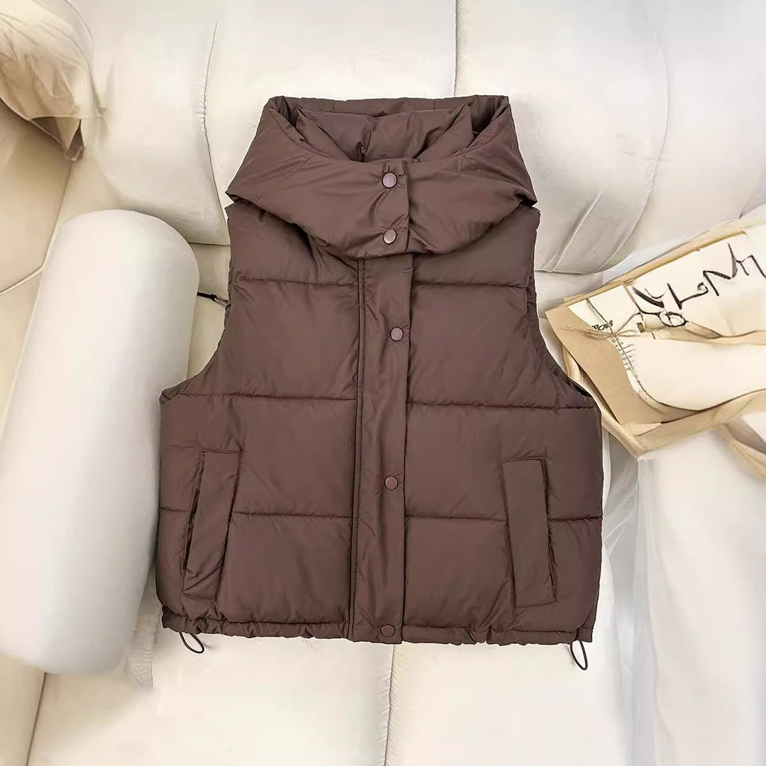 Women’s short quilted vest with voluminous stand-up collar, snap button placket, and adjustable drawstring hem Mune Fashion