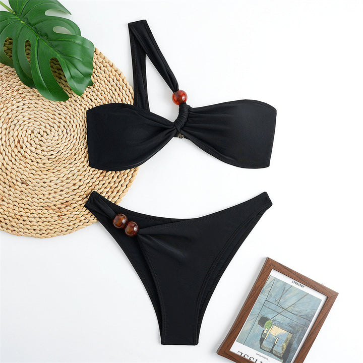 Women's bikini set with asymmetric halter neck and decorative pants buttons Mune Fashion