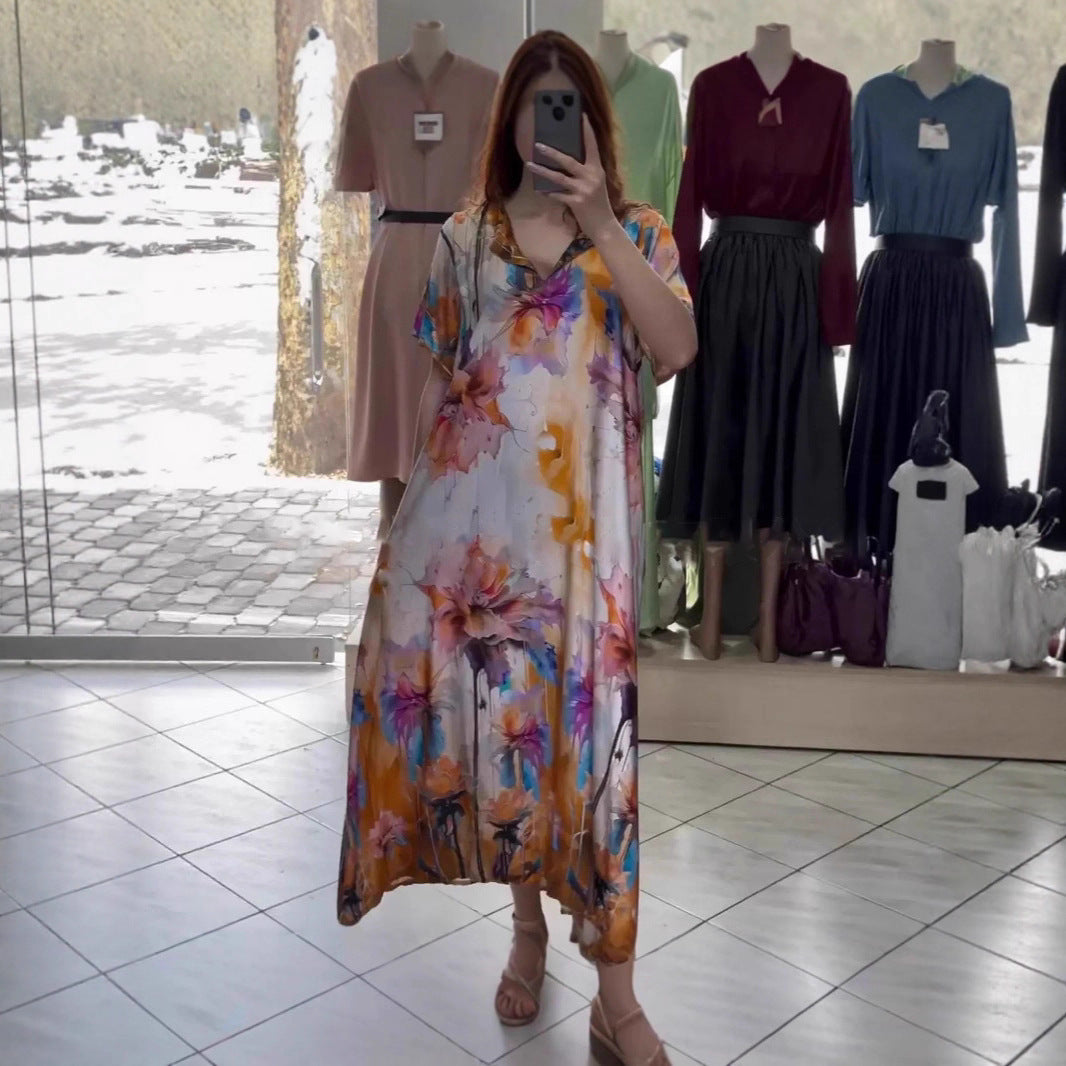 Women flowing maxi kaftan dress with V-neck and large watercolor floral print Mune Fashion