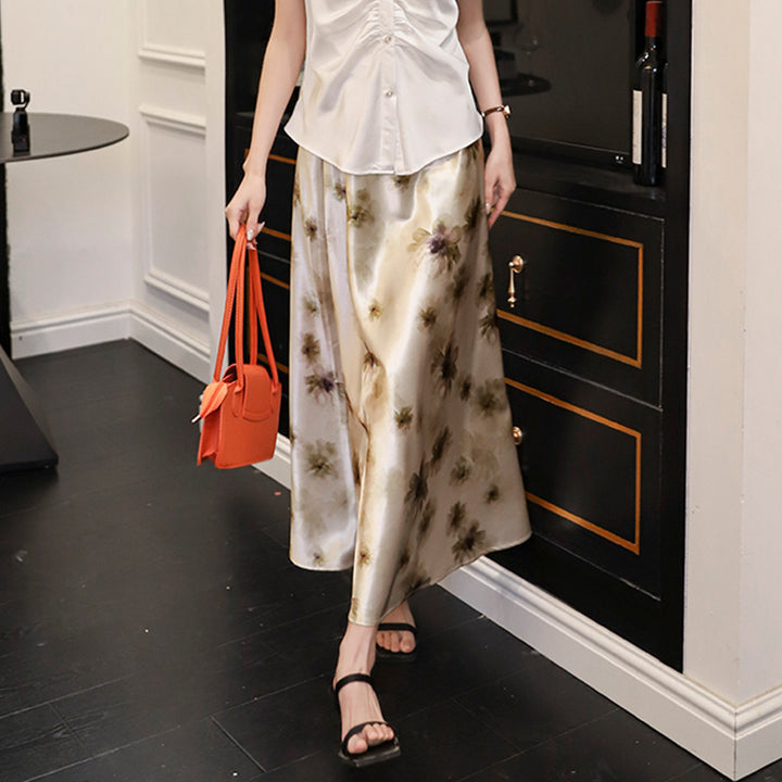 Women's elegant A-line midi skirt with watercolor floral print and fine satin look.