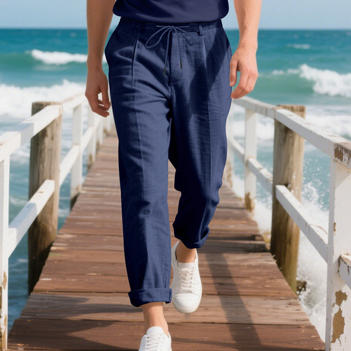 Men's beach-suitable linen blend lounge pants with elastic drawstring, subtle pleat, and rolled ankle hem Mune Fashion