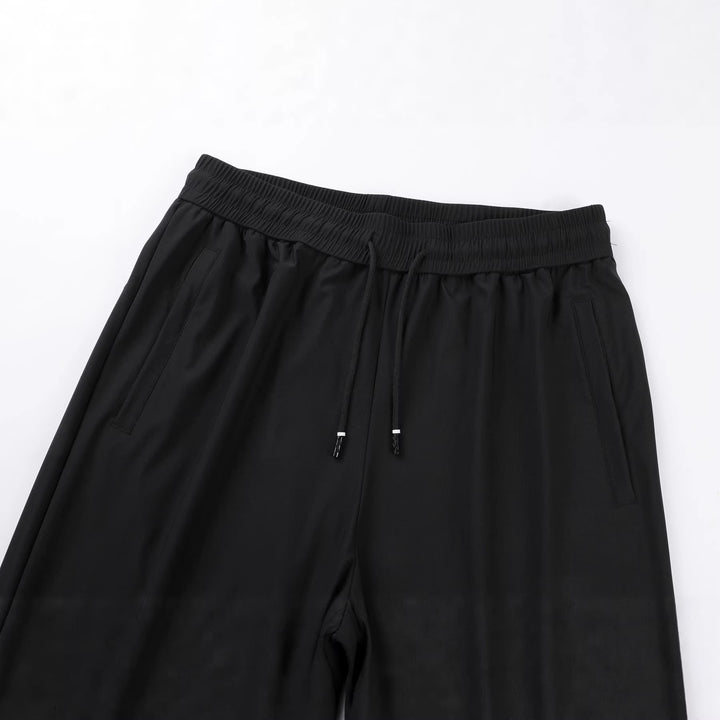 Men's lightweight tapered jogging pants with elastic comfort waistband, drawstring, and side pockets Mune Fashion