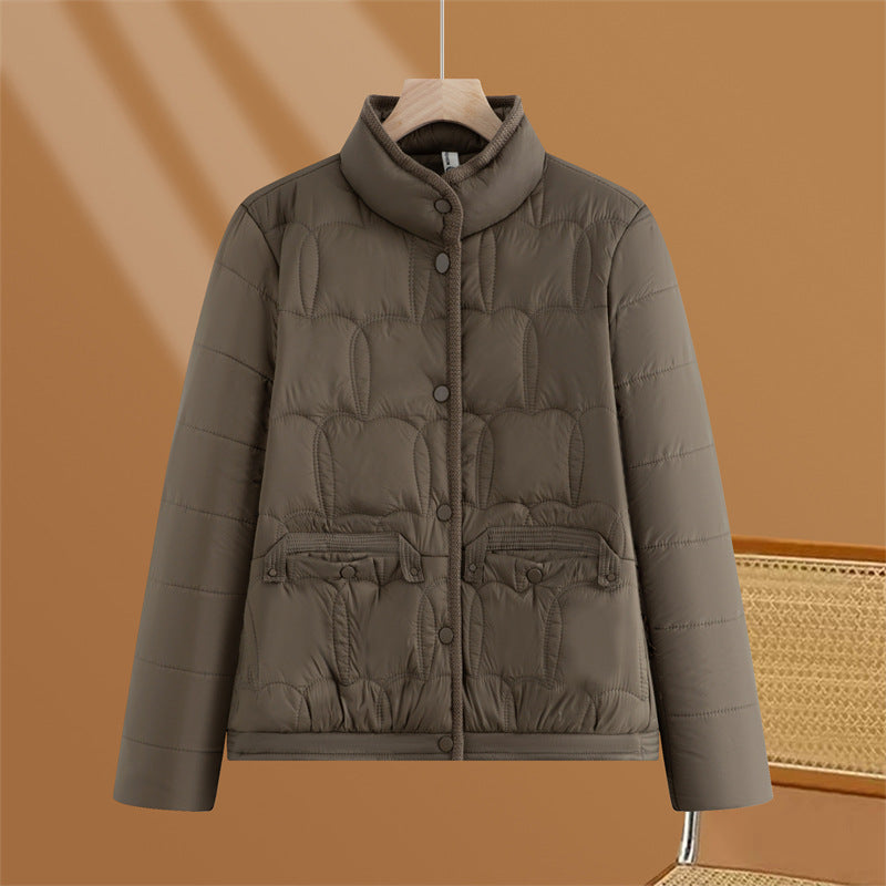 Women's short quilted transitional jacket with stand-up collar and flap pockets Mune Fashion