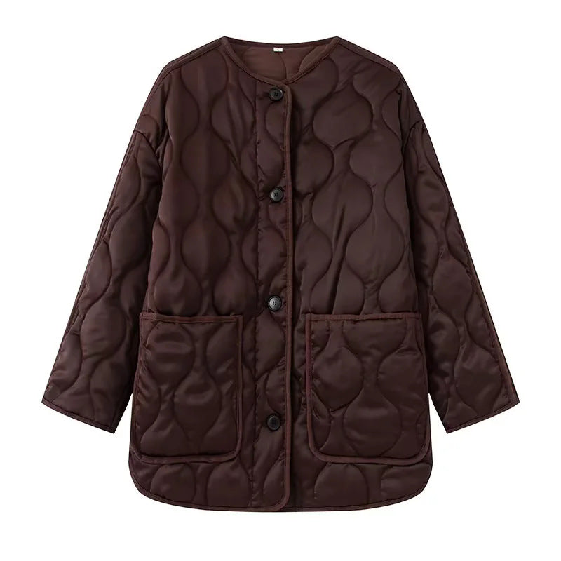 Women's quilted transitional jacket in boxy cut with round neckline, organic wave quilting, and patch pockets Mune Fashion
