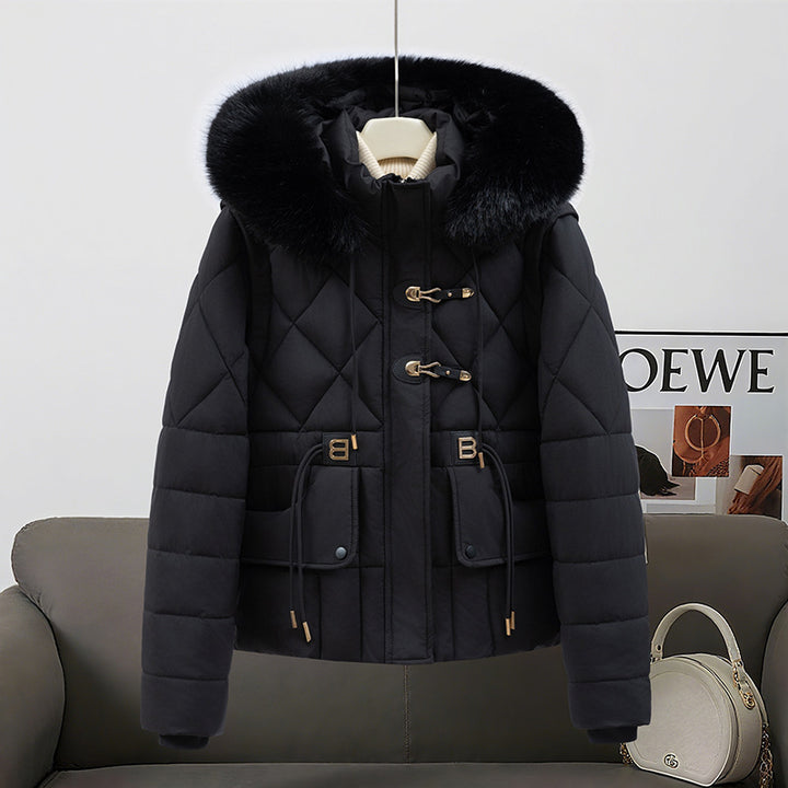 Women's short quilted hooded jacket with voluminous faux fur trim, drawstring waist, and flap pockets Mune Fashion