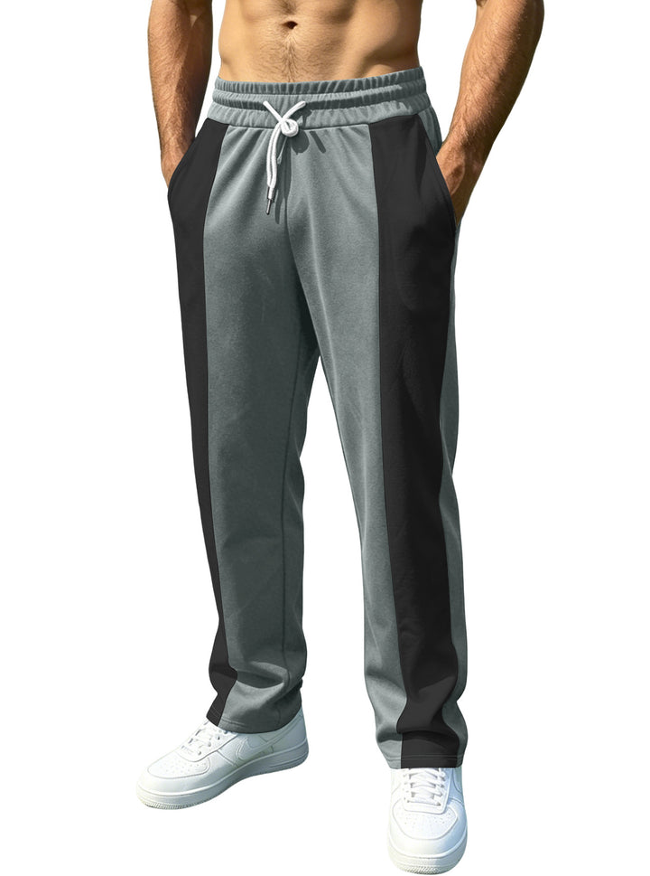 Men's sporty jogging pants with contrasting side inserts, elastic waistband, drawstring, and side pockets Mune Fashion