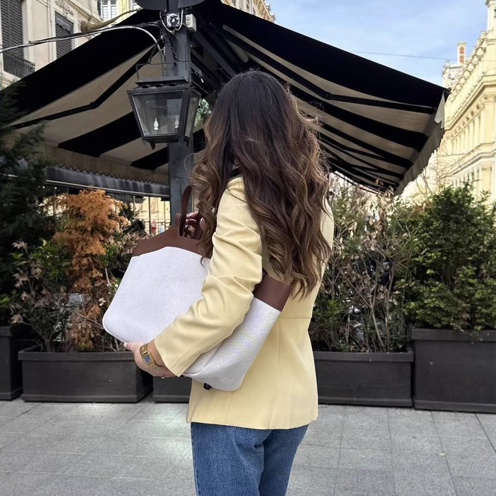 Women's tailored button blazer with round neckline and faux flap pockets Mune Fashion