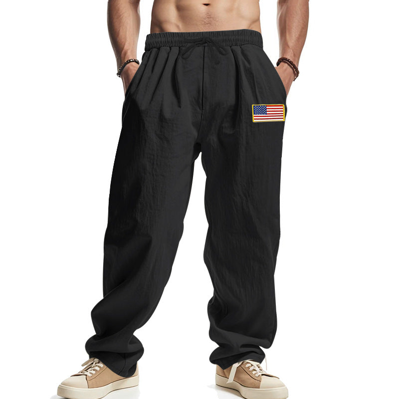 Men's loose-fitting leisure pants in linen look with elastic waist, drawstring & flag patch Mune Fashion