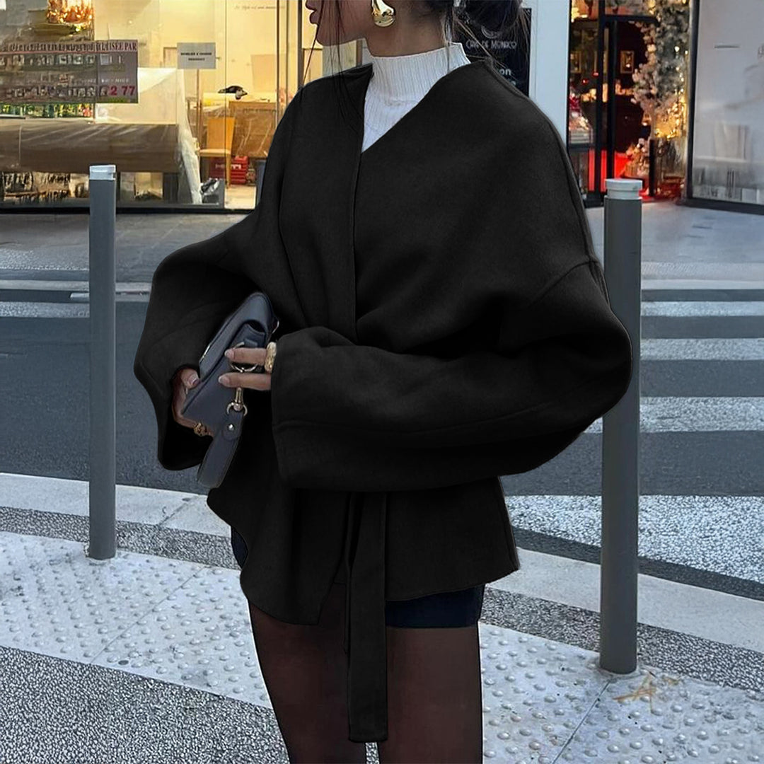 Women’s light wrap coat with tie belt, dropped sleeves and feminine waist emphasis Mune Fashion